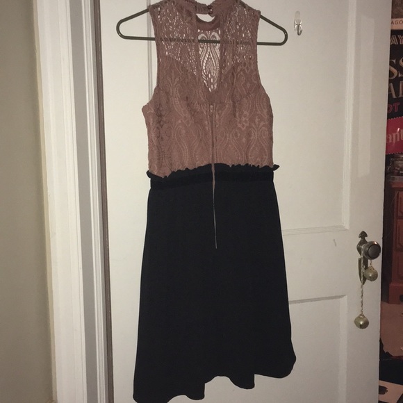 A dress with a black skirt and pick lace top. - Picture 2 of 3